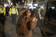 Christmas revellers make the most of the last night of bars being open before London is moved to Tier 3 restrictions.