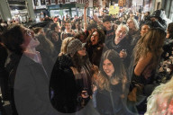Christmas revellers make the most of the last night of bars being open before London is moved to Tier 3 restrictions.