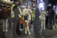Christmas revellers make the most of the last night of bars being open before London is moved to Tier 3 restrictions.