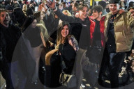 Christmas revellers make the most of the last night of bars being open before London is moved to Tier 3 restrictions.