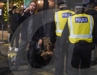 Christmas revellers make the most of the last night of bars being open before London is moved to Tier 3 restrictions.