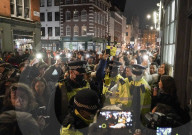 Christmas revellers make the most of the last night of bars being open before London is moved to Tier 3 restrictions.