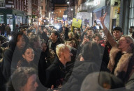 Christmas revellers make the most of the last night of bars being open before London is moved to Tier 3 restrictions.