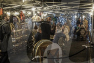 Christmas revellers make the most of the last night of bars being open before London is moved to Tier 3 restrictions.
