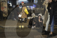 Christmas revellers make the most of the last night of bars being open before London is moved to Tier 3 restrictions.