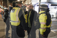 Christmas revellers make the most of the last night of bars being open before London is moved to Tier 3 restrictions.