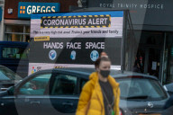 A huge coronavirus alert sign warning members of the public to be vigilant appears in Putney, South West London. 