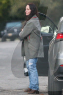 Madeleine Stowe is seen out running errands with her dog in Los Angeles on Saturday afternoon. 
