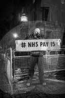 A grassroots campaign, NHS Workers say No, demonstrate in front of Downing Street.