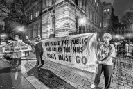 A grassroots campaign, NHS Workers say No, demonstrate in front of Downing Street.