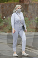Ariel Winter braves the LA rain as she steps out to pick up groceries and ice cream from Baskin Robbins.