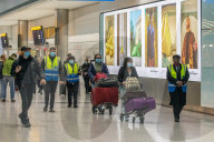 Passengers arrive at London Heathrow today as quaranting of passengers continues. 