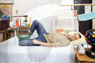Chain reaction machine artist Joseph Herscher with his inventions at home 