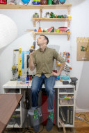 Chain reaction machine artist Joseph Herscher with his inventions at home 