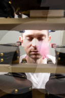 Chain reaction machine artist Joseph Herscher with his inventions at home 