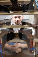 Chain reaction machine artist Joseph Herscher with his inventions at home 