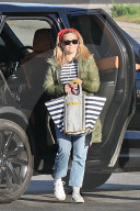 Reese Witherspoon is seen departing from a Los Angeles airport in a private jet.