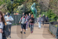 Londoners bask in unseasonally warm weather as UK Covid-19 threat level lowered