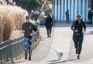Londoners bask in unseasonally warm weather as UK Covid-19 threat level lowered