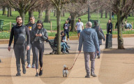 Londoners bask in unseasonally warm weather as UK Covid-19 threat level lowered