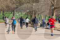 Londoners bask in unseasonally warm weather as UK Covid-19 threat level lowered