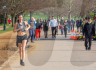 Londoners bask in unseasonally warm weather as UK Covid-19 threat level lowered