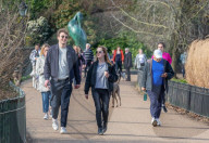 Londoners bask in unseasonally warm weather as UK Covid-19 threat level lowered