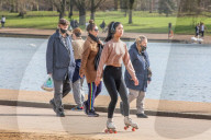 Londoners bask in unseasonally warm weather as UK Covid-19 threat level lowered
