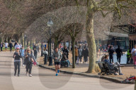 Londoners bask in unseasonally warm weather as UK Covid-19 threat level lowered