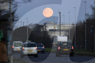 The moon sets near Heathrow this morning.