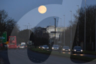 The moon sets near Heathrow this morning.