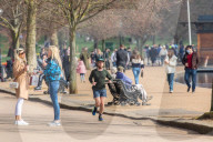 Famillies enjoy the spring weather as police enforce Covid-19 rules.