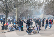 Famillies enjoy the spring weather as police enforce Covid-19 rules.