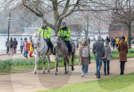 Famillies enjoy the spring weather as police enforce Covid-19 rules.