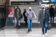 Office workers arrive at Victoria Station in London this morning as Chancellor Rishi Sunak unveils his 2021 Budget. 