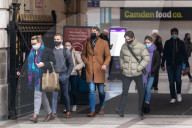 Office workers arrive at Victoria Station in London this morning as Chancellor Rishi Sunak unveils his 2021 Budget. 