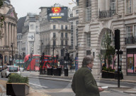 A government Covid-19 information sign high above Piccadilly Circus.