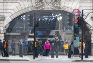 Office workers arrive at Victoria Station in London this morning as Chancellor Rishi Sunak unveils his 2021 Budget. 