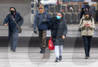 Office workers arrive at Victoria Station in London this morning as Chancellor Rishi Sunak unveils his 2021 Budget. 