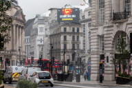 A government Covid-19 information sign high above Piccadilly Circus.