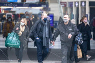 Office workers arrive at Victoria Station in London this morning as Chancellor Rishi Sunak unveils his 2021 Budget. 