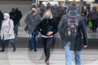 Office workers arrive at Victoria Station in London this morning as Chancellor Rishi Sunak unveils his 2021 Budget. 