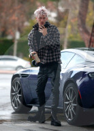 Machine Gun Kelly is seen filing up his Aston Martin at a gas station in Thousand Oaks on Wednesday afternoon. 