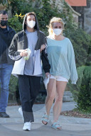 Britney Spears is chaperoned by her boyfriend Sam Asghari and one of her sons as she steps out for the first time in several months as the controversy surrounding her conservatorship rages on.