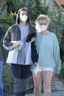 Britney Spears is chaperoned by her boyfriend Sam Asghari and one of her sons as she steps out for the first time in several months as the controversy surrounding her conservatorship rages on.