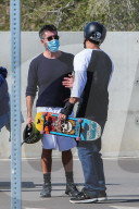 Simon Cowell and his girlfriend Lauren Silverman take their 7-year-old son Eric to a skatepark in Malibu. 