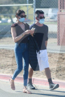 Simon Cowell and his girlfriend Lauren Silverman take their 7-year-old son Eric to a skatepark in Malibu. 