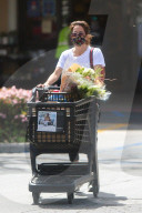 Brooke Burke, 49, flashes her midriff as she leaves RalphÍs grocery store in Malibu on Wednesday afternoon. 