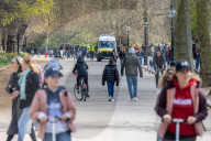 Public enjoy the sunshine in Hyde Park, ahead of the opening of shops tomorrow.