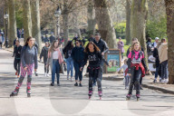 Public enjoy the sunshine in Hyde Park, ahead of the opening of shops tomorrow.